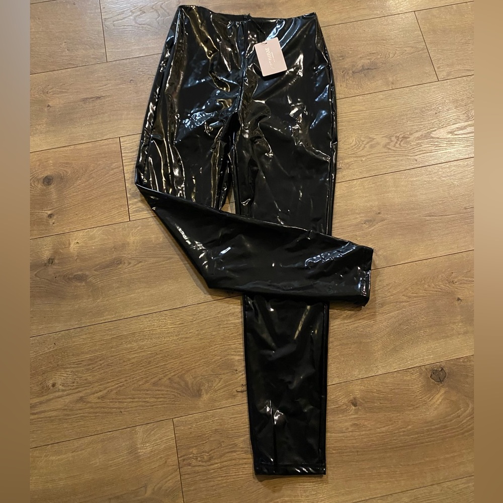 Women’s patent leather zip up pants.  black. Size S or US size 4. NWT.